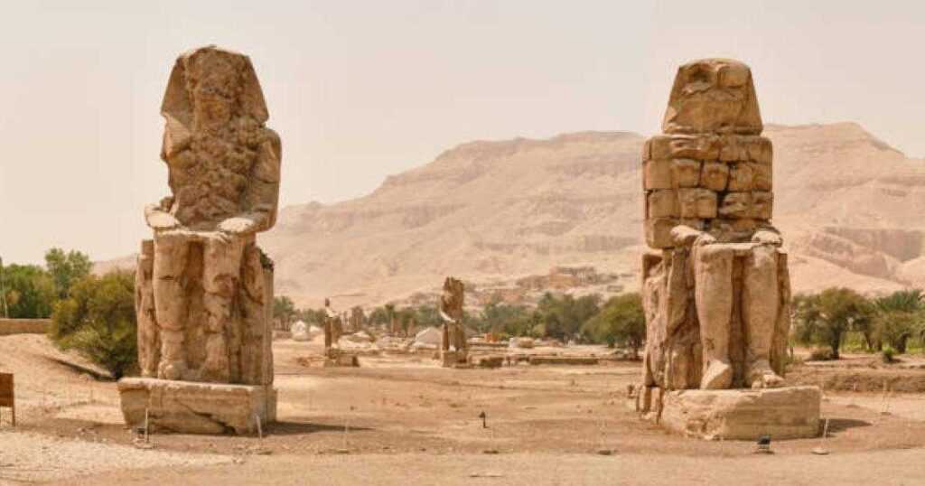 Colossi of Memnon (statues of Pharaoh Amenhotep III), Luxor, Egypt. Source: VLAD ANTONOV / Adobe Stock