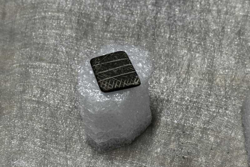 Neolithic-era stone seal displayed alongside other artifacts discovered at the Tadim Fortress and Hoyuk, providing insights into the earliest settlements and daily life in the Elazig region of Türkiye, December 30, 2025. (Photo: AA)