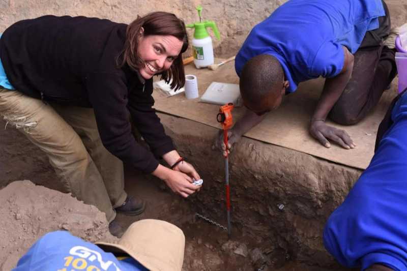 Jessica Thompson and team members excavating and mapping the cremation pyre. Credit: Grace Veatch / Yale University