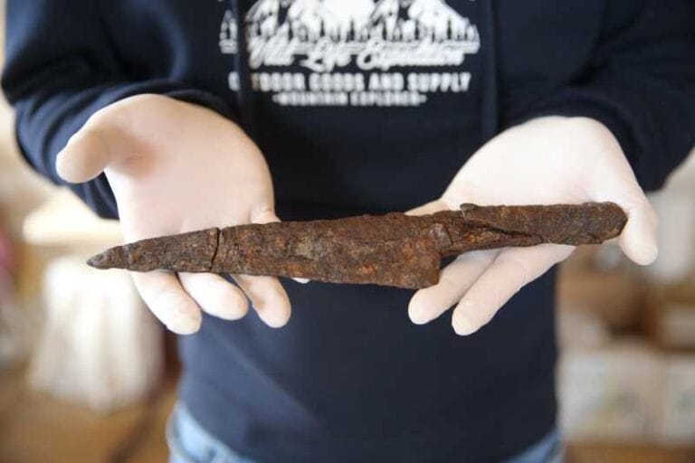 A restored ancient knife, approximately 1,500 years old, is carefully held during conservation work in Hadrianopolis, in Karabük, Türkiye, on April 17, 2026. (Photo: AA)