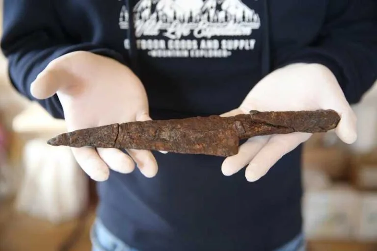 A restored ancient knife, approximately 1,500 years old, is carefully held during conservation work in Hadrianopolis, in Karabük, Türkiye, on April 17, 2026. (Photo: AA)