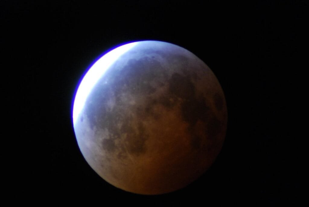 Near the end of partial phases during the Winter Solstice total lunar eclipse of 2010. Credit: Dave Dickinson.