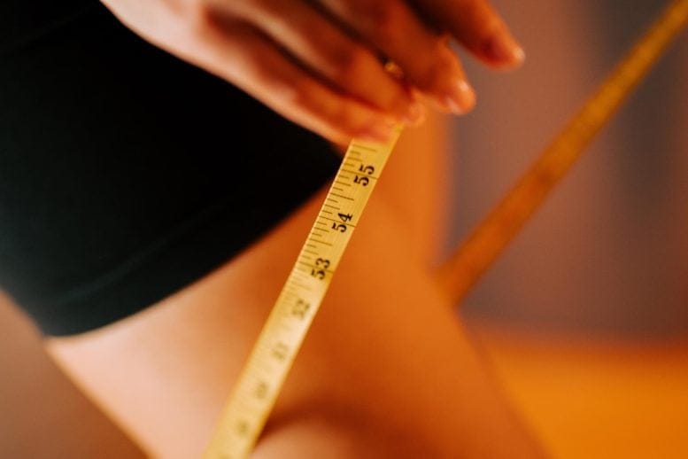 Fit Woman Measuring Thigh