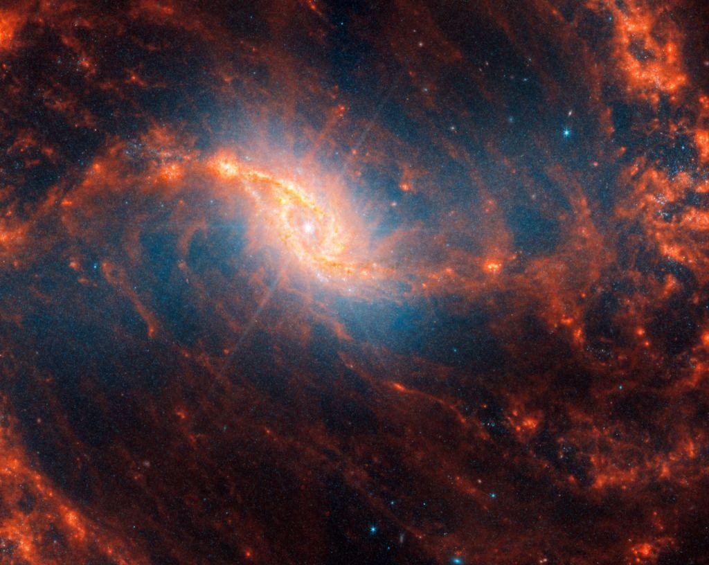 The diffraction spike in the center of NGC 1365 is a telescope artifact caused by an enormous amount of light in a compact region. Credit: NASA, ESA, CSA, STScI, Janice Lee (STScI), Thomas Williams (Oxford), PHANGS Team