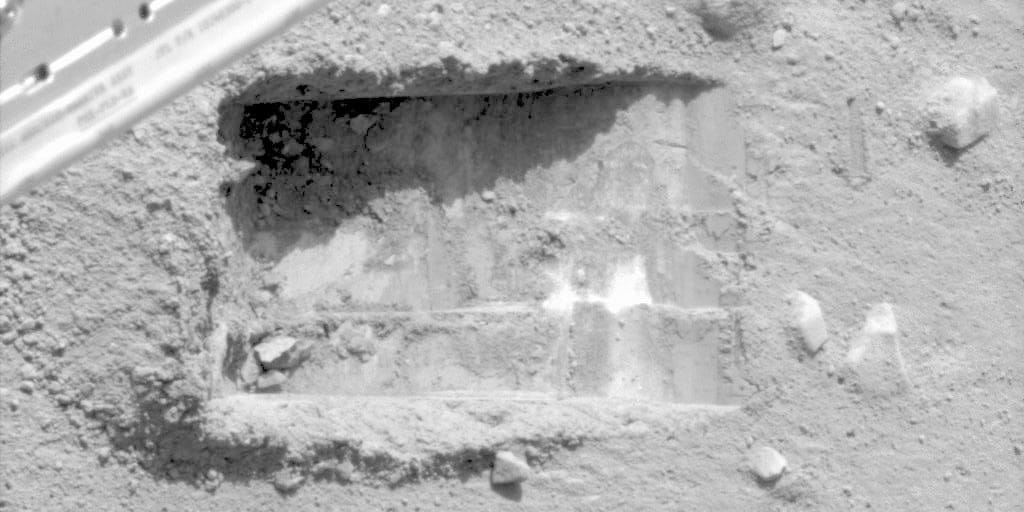 Ice in Phoenix's "Dodo-Goldilocks" trench, photographed in June 2008. The lumps in the lower simply sublimated away. Salt couldn't do that which is how we knew it was water (Credit : NASA/JPL-Caltech/University of Arizona/Texas A&M University)