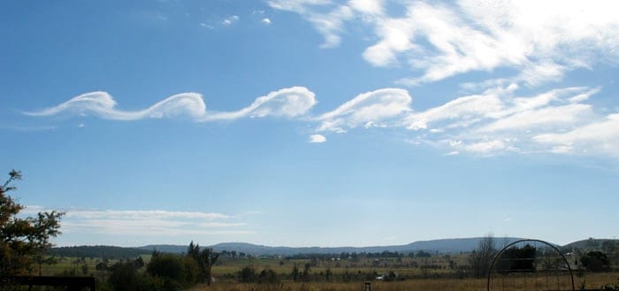 Wave clouds from Kelvin-Helmholtz instabilities forming over Mount Duval, NSW in Australia. Courtesy GRAHAMUK, via Creative Commons Attribution-Share Alike 3.0 Unported