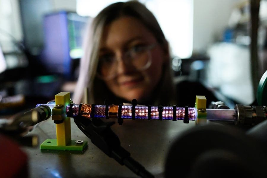 McKinney and her Nanosecond Repetitively Pulsed Dielectric Barrier Discharge (NRP-DBD) device. Credit: Gretchen Ertl/MIT News
