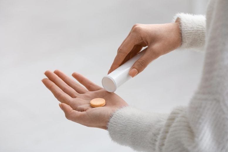 Young Woman Vitamin C Soluble Tablet