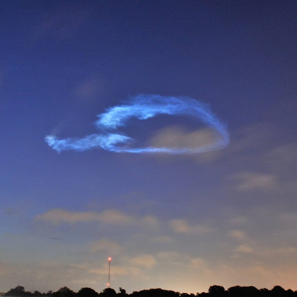 Neon-blue noctilucent clouds seen post launch. Credit: Dave Dickinson.