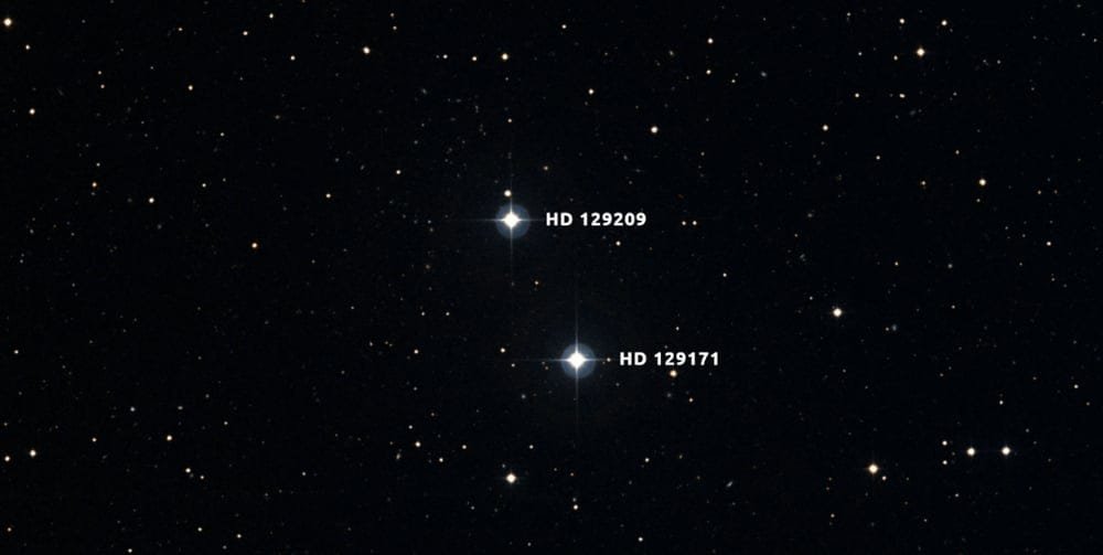 HD 129209/HD 129171 is a binary pair of Sun-like stars about 180 light years away. The differences in their Beryllium abundances suggest that HD 129171 engulfed a rocky planet in its past. The research shows it absorbed about 11 Earth masses of rocky material. Image Credit: Digital Sky Survey/Aladin/Anne Rathsam.