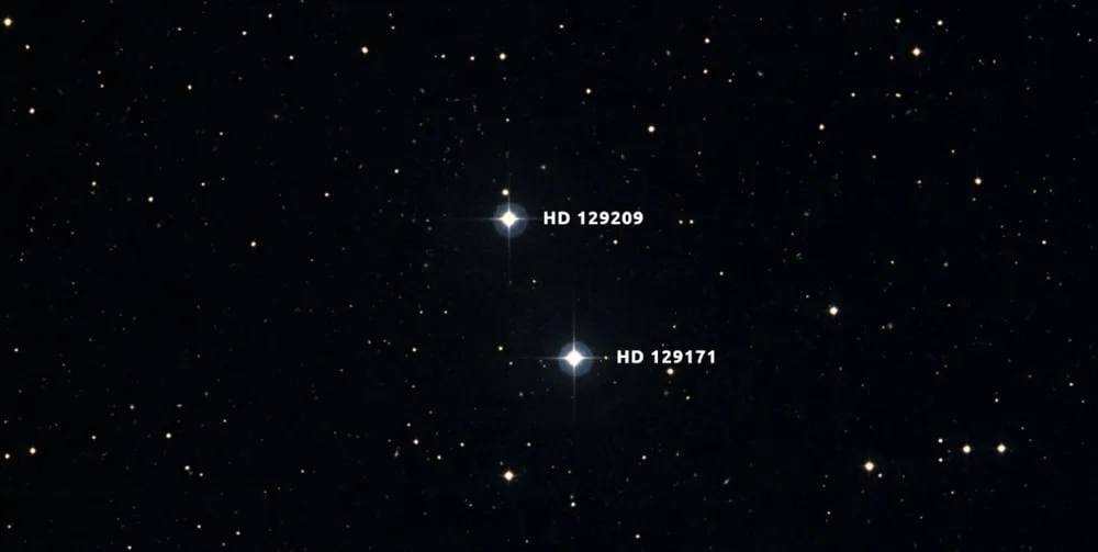 HD 129209/HD 129171 is a binary pair of Sun-like stars about 180 light years away. The differences in their Beryllium abundances suggest that HD 129171 engulfed a rocky planet in its past. The research shows it absorbed about 11 Earth masses of rocky material. Image Credit: Digital Sky Survey/Aladin/Anne Rathsam.
