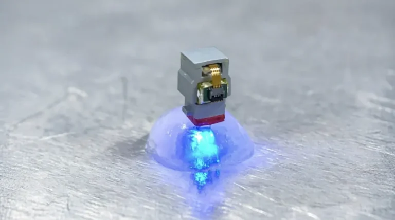 Optical stimulation via the implant, showing blue light. Credit: Jae-Woong Jeong/KAIST.