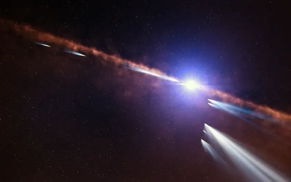 This illustration shows exocomets approaching a distant star. As the comets are warmed, volatiles sublimate off of them, creating the type of puzzling spectral lines found around PDS 70. Image Credit: ESO/L. Calçada