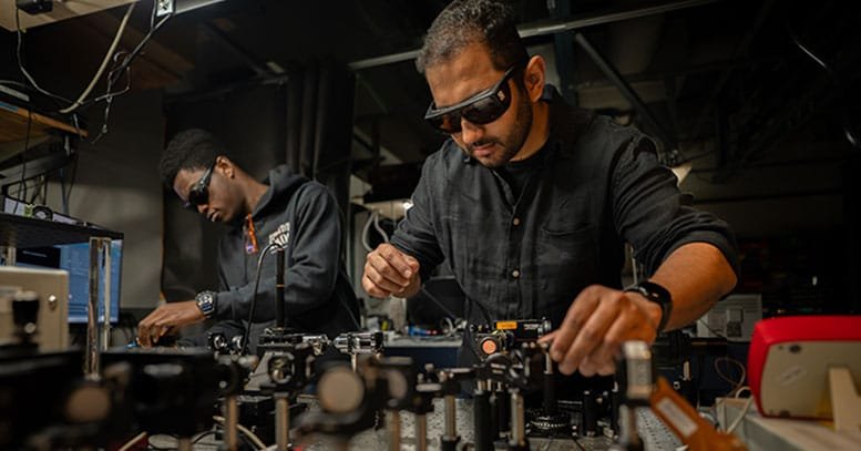 Muhammad Waleed Khalid and Koffi Sadzi Adjust Optics