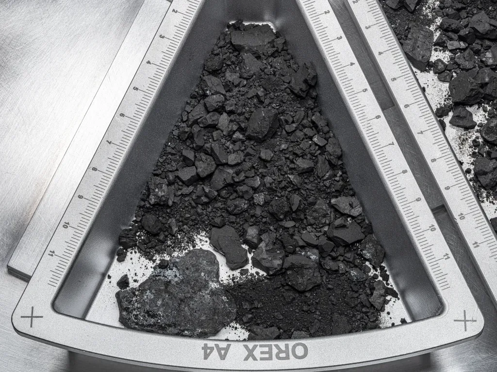The half a gram of Bennu material that was sent to ETH Zurich. Credit - Erika Blumenfeld & Joseph Aebersold / NASA